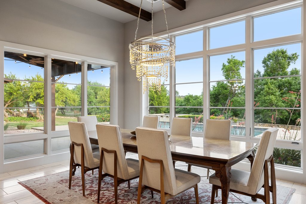 2560 Bell Springs Road Dripping Springs, TX 78620 - Photo 18 of 40 a view of a dining room with furniture window and outside view