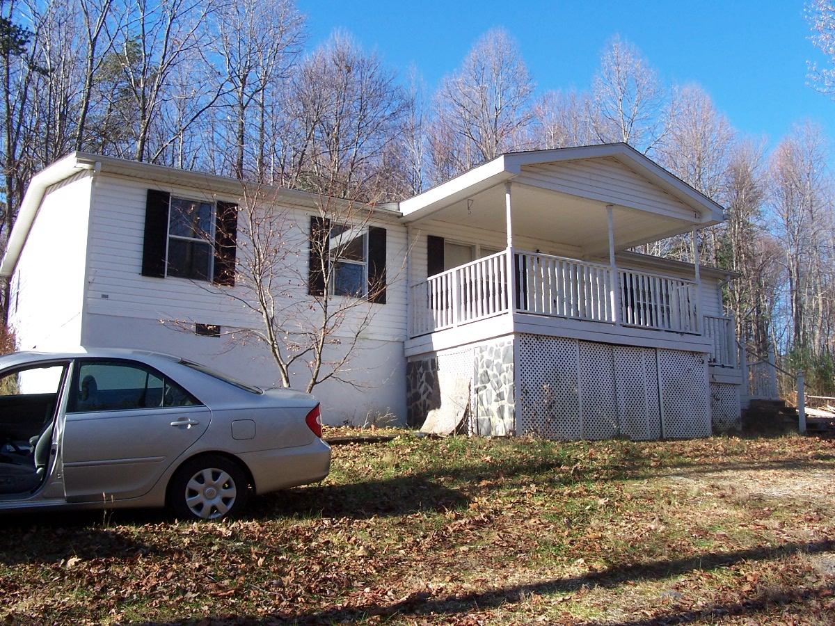 448 Fairview Church Road Southwest Floyd, VA 24091 - Photo 1 of 1 a front view of a house with parking area