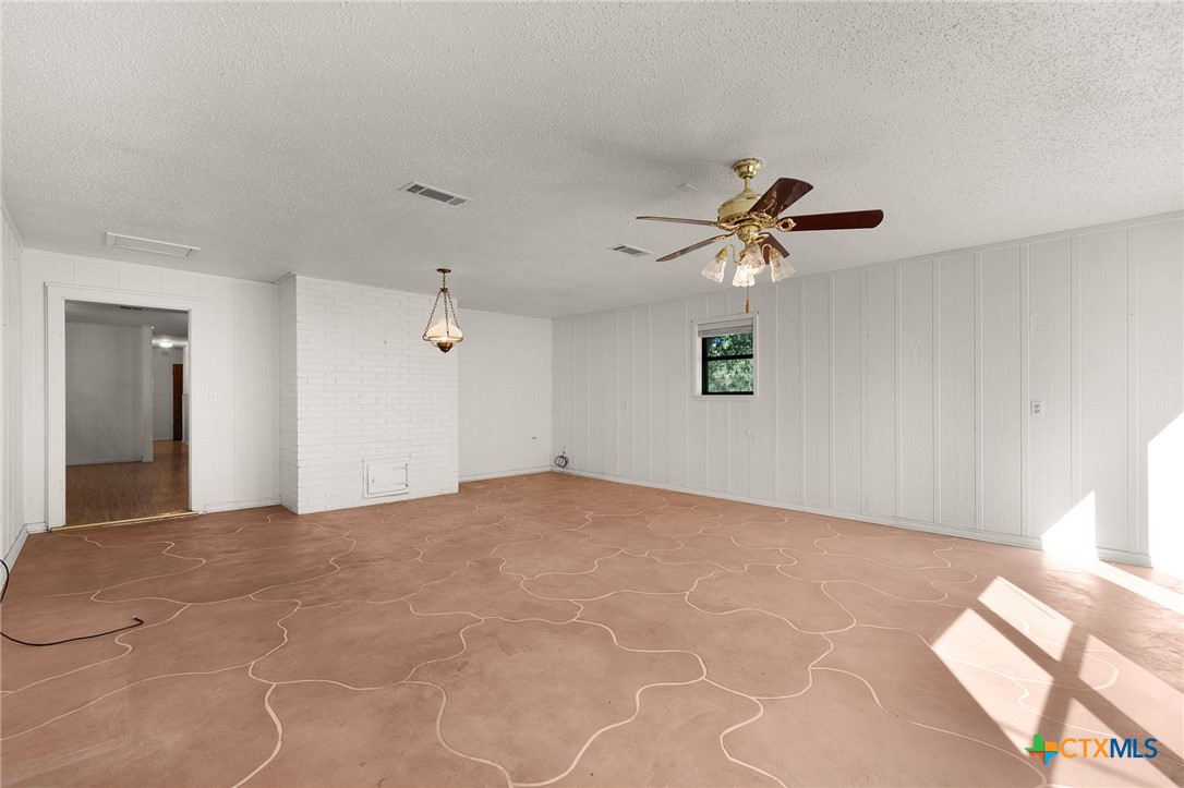 1830 Fm 221 Hamilton, TX 76531 - Photo 15 of 45 a view of a room with a ceiling fan and a window