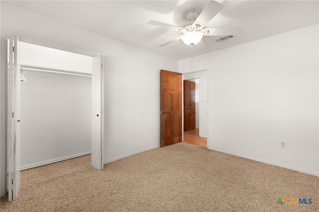 1830 Fm 221 Hamilton, TX 76531 - Photo 17 of 45 a view of an empty room with a ceiling fan