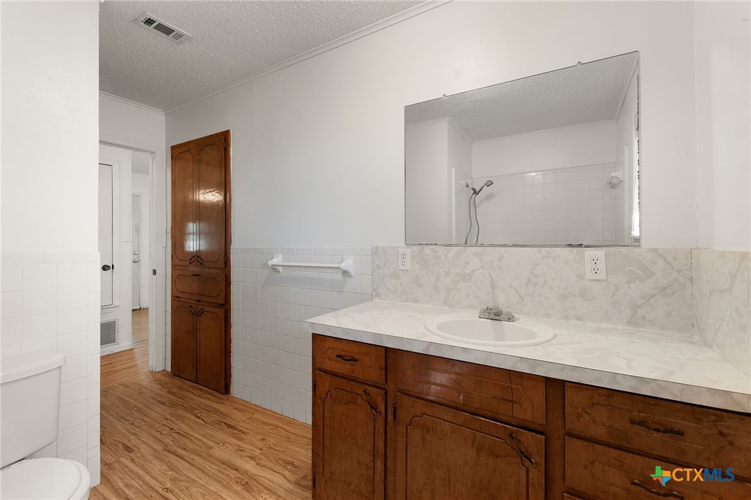 1830 Fm 221 Hamilton, TX 76531 - Photo 20 of 45 a bathroom with a sink and a mirror