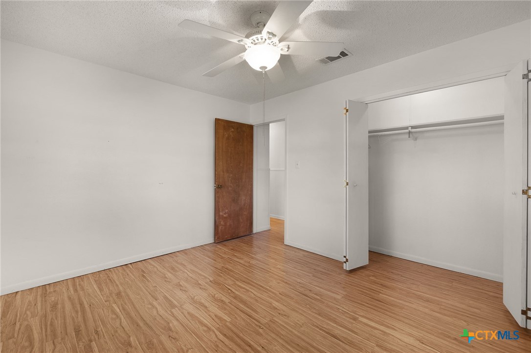 1830 Fm 221 Hamilton, TX 76531 - Photo 22 of 45 a view of an empty room with wooden floor