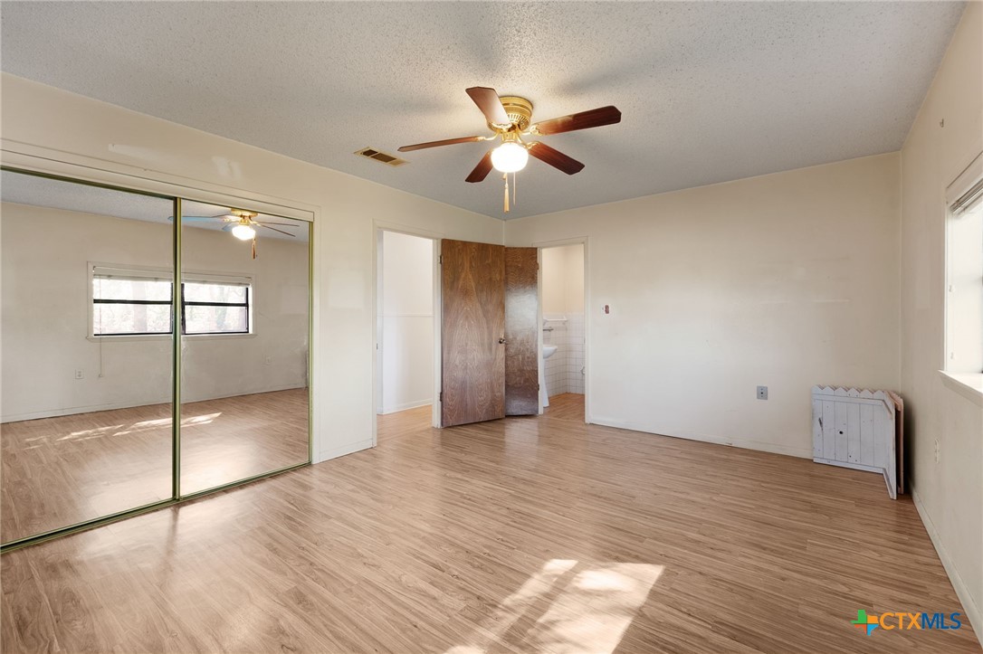 1830 Fm 221 Hamilton, TX 76531 - Photo 23 of 45 a view of an empty room with window and wooden floor