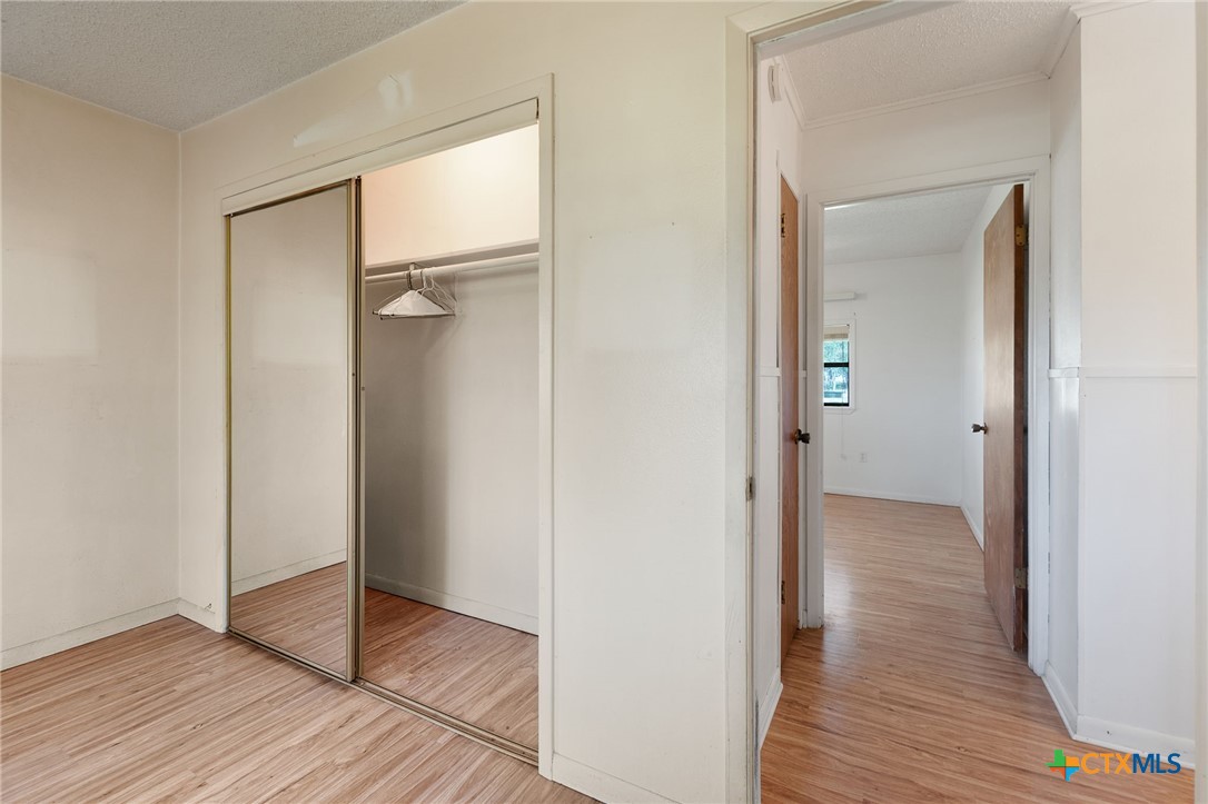 1830 Fm 221 Hamilton, TX 76531 - Photo 24 of 45 a view of hallway with wooden floor