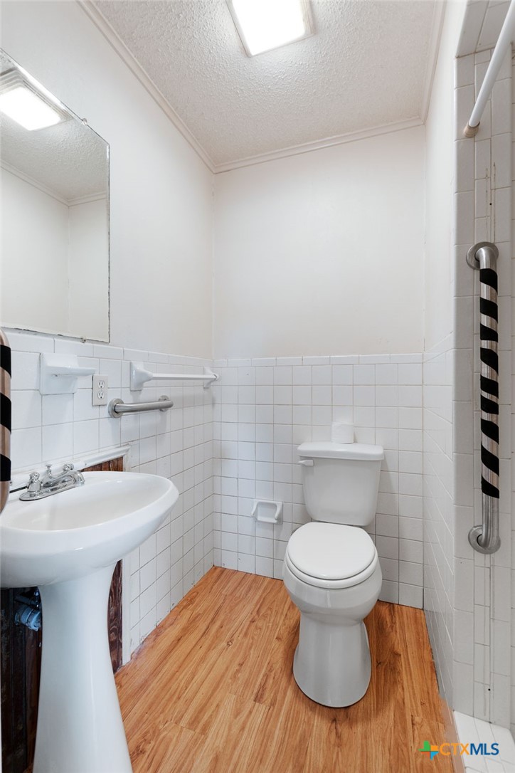 1830 Fm 221 Hamilton, TX 76531 - Photo 25 of 45 a bathroom with a sink and a toilet