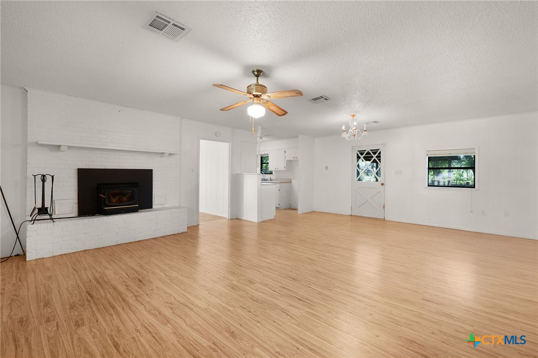 1830 Fm 221 Hamilton, TX 76531 - Photo 5 of 45 a view of an empty room with window and fireplace