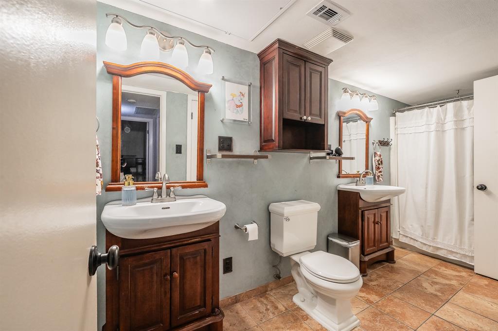 655 Ridgeline Drive Hurst, TX 76053 - Photo 21 of 29 His & her sinks with a shower tub combo