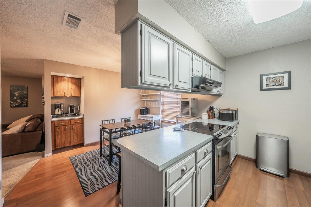 655 Ridgeline Drive Hurst, TX 76053 - Photo 7 of 29 Freshly painted kitchen cabinets
