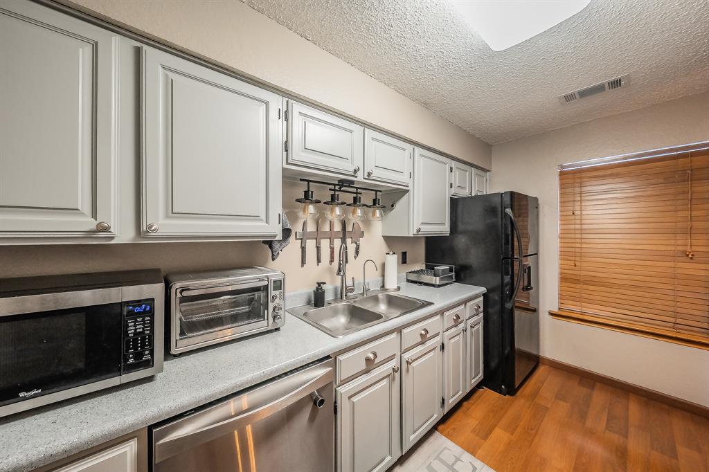 655 Ridgeline Drive Hurst, TX 76053 - Photo 9 of 29 Stainless steel dishwasher & fridge stays with the property