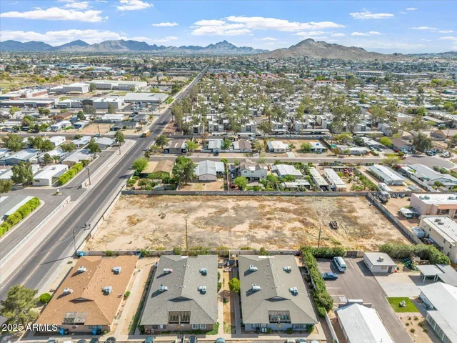 an aerial view of residential houses with outdoor space