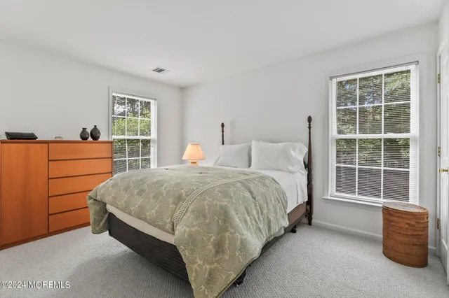 a view of a wooden deck with furniture