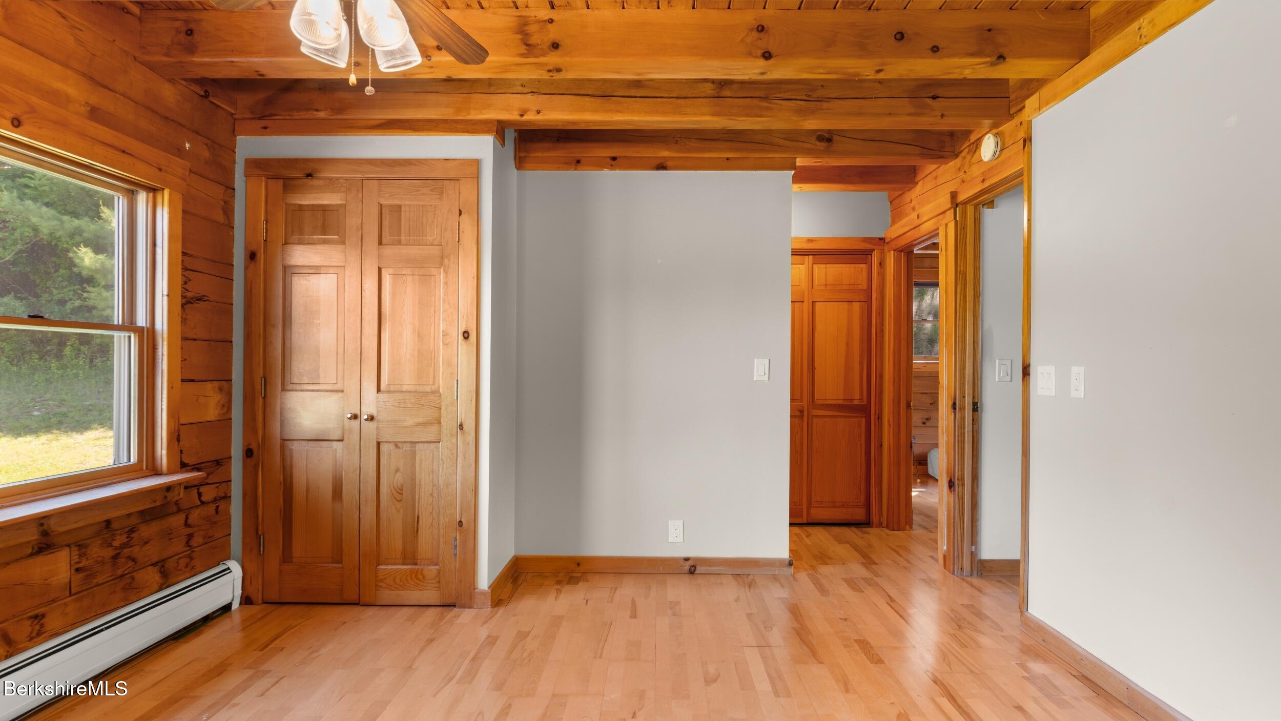 134 Hurlburt Road Great Barrington, MA 01230 - Photo 24 of 50 a view of empty room with wooden floor and fan