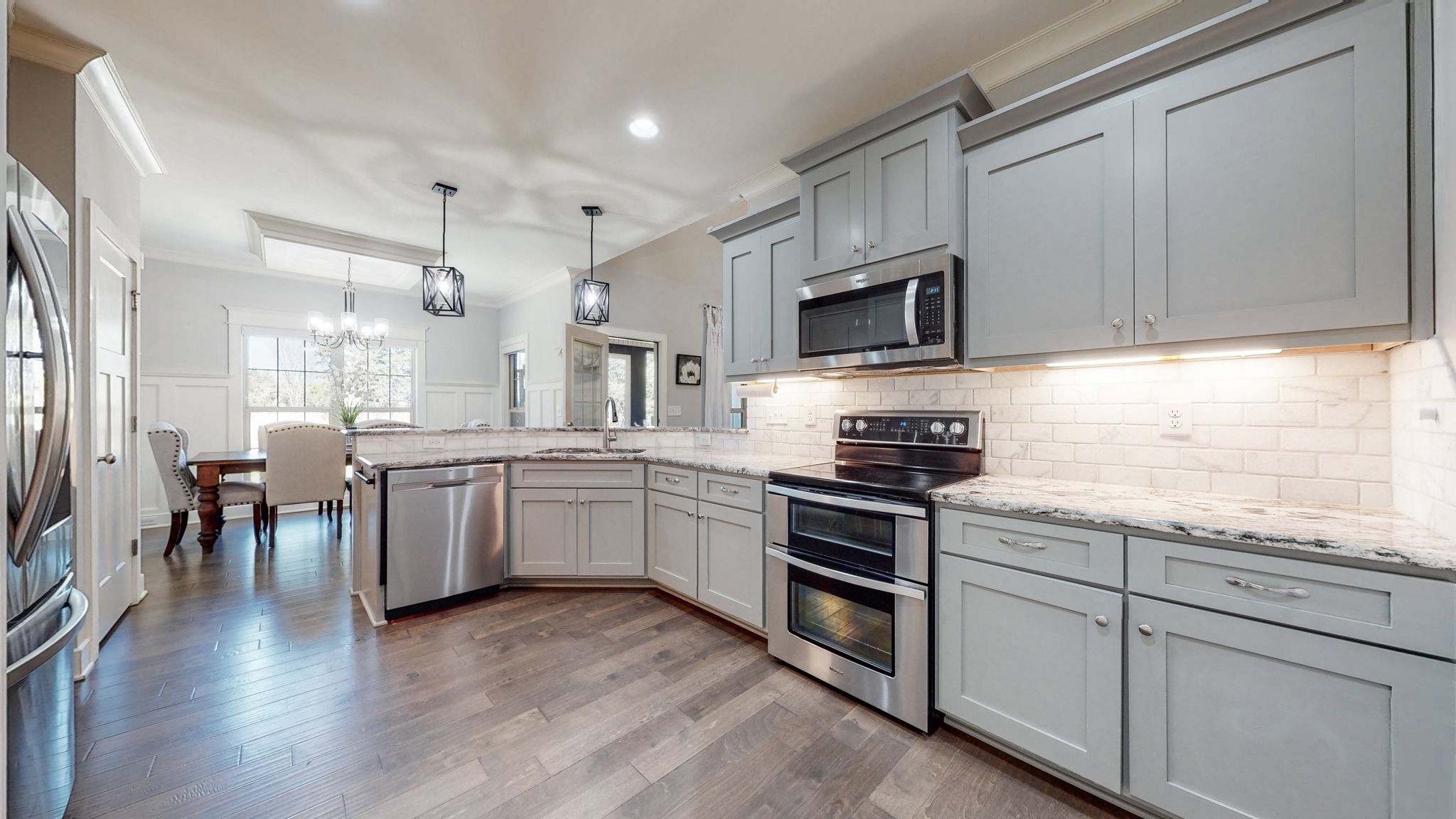262 Ridgewater Way Mount Juliet, TN 37122 - Photo 12 of 58 a kitchen with granite countertop cabinets stainless steel appliances and wooden floor