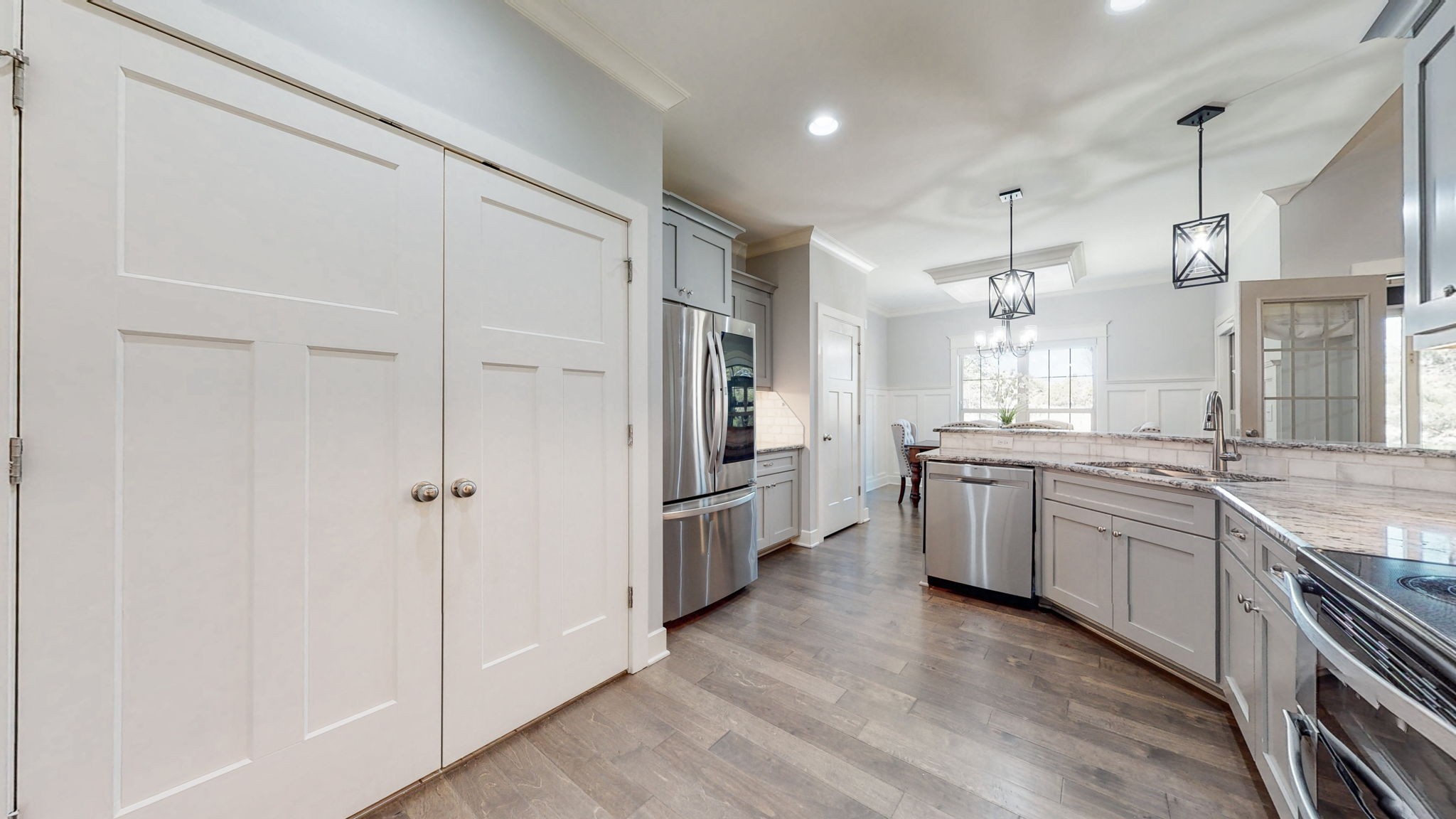 262 Ridgewater Way Mount Juliet, TN 37122 - Photo 13 of 58 a large kitchen with white cabinets and stainless steel appliances