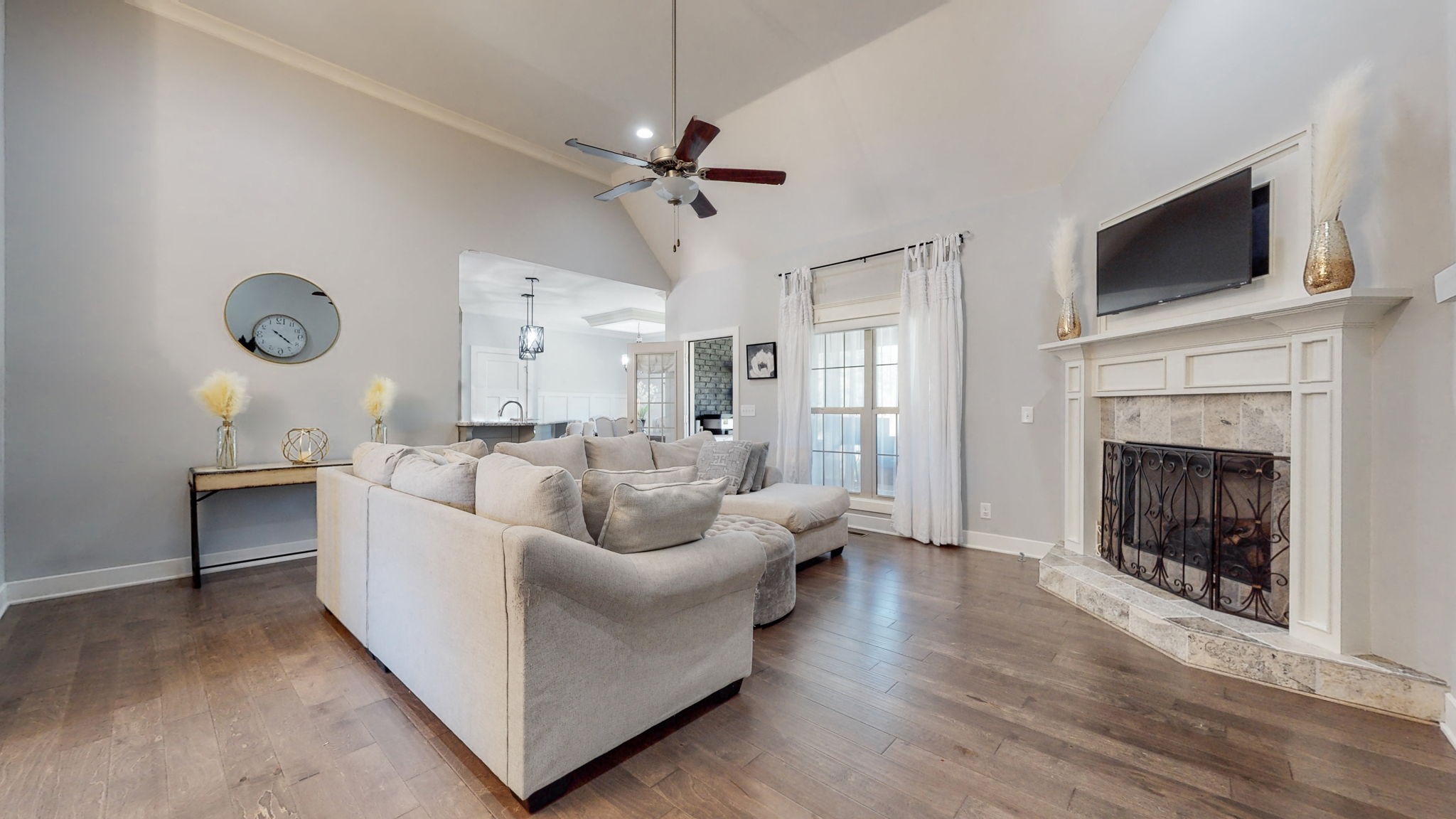 262 Ridgewater Way Mount Juliet, TN 37122 - Photo 4 of 58 a living room with furniture a fireplace and a flat screen tv