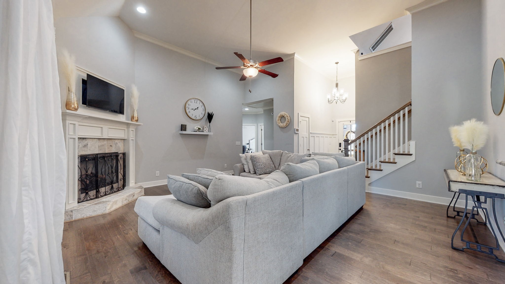 262 Ridgewater Way Mount Juliet, TN 37122 - Photo 7 of 58 a living room with furniture a fireplace and a flat screen tv