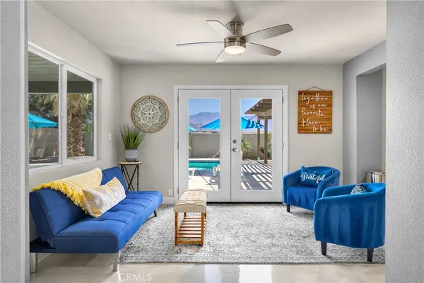 a living room with furniture and window