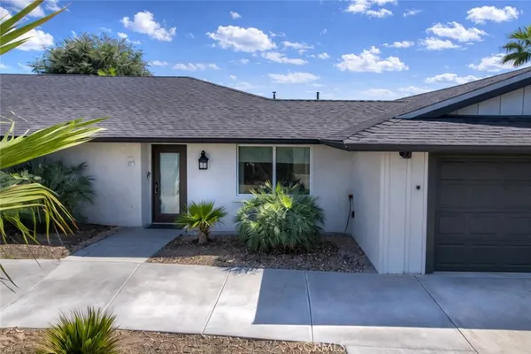 a front view of house with yard