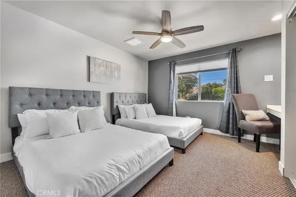 a bedroom with bed and window