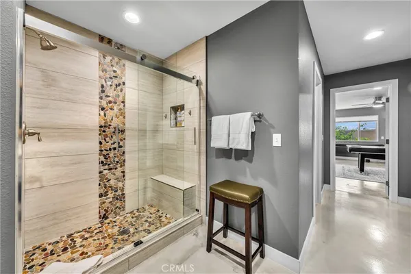 a bathroom with a shower and a sink