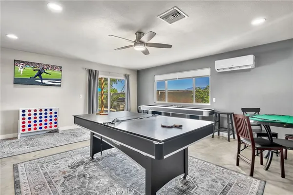 a dining room with a table and chairs