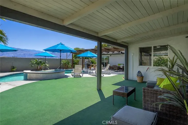 a patio with garden area and patio