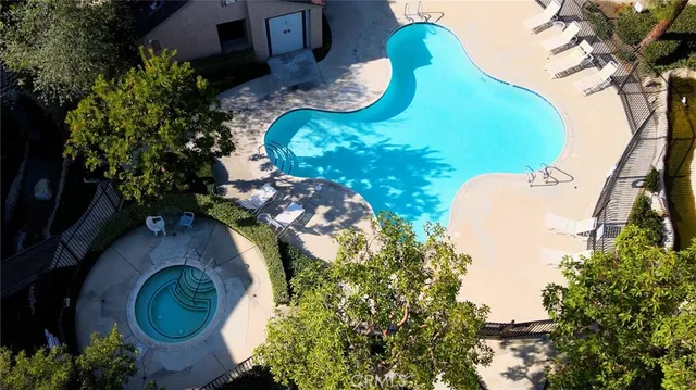 an aerial view of a swimming pool and outdoor space
