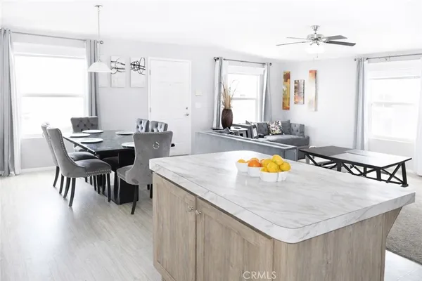 a view of a dining room with furniture and chandelier