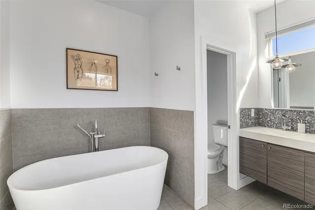 a white bath tub sitting in a bathroom