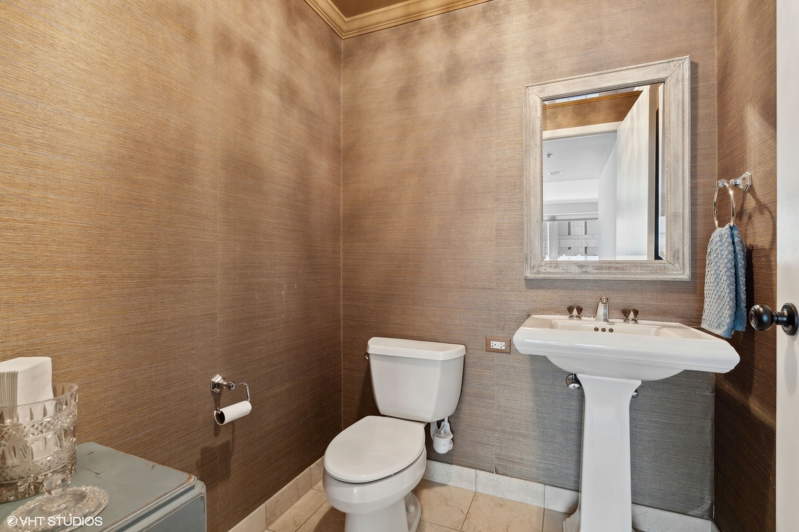 57 East Delaware Place, Unit 1801 Chicago, IL 60611 - Photo 11 of 19 a bathroom with a sink toilet and a mirror