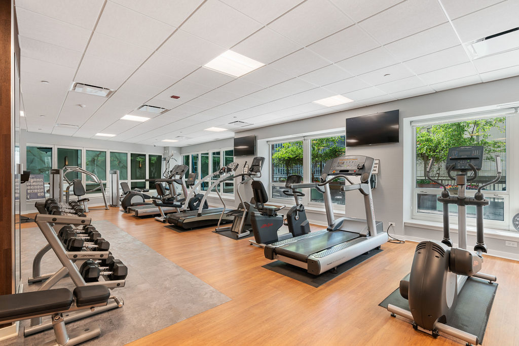 57 East Delaware Place, Unit 1801 Chicago, IL 60611 - Photo 15 of 19 a view of a room with gym equipment