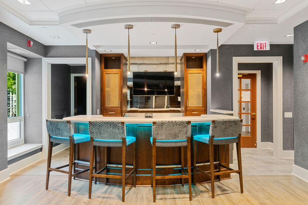 57 East Delaware Place, Unit 1801 Chicago, IL 60611 - Photo 18 of 19 a kitchen with a table and chairs in it