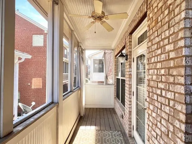 a view of a hallway with a chandelier