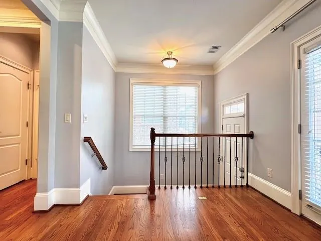 a view of entryway with wooden floor