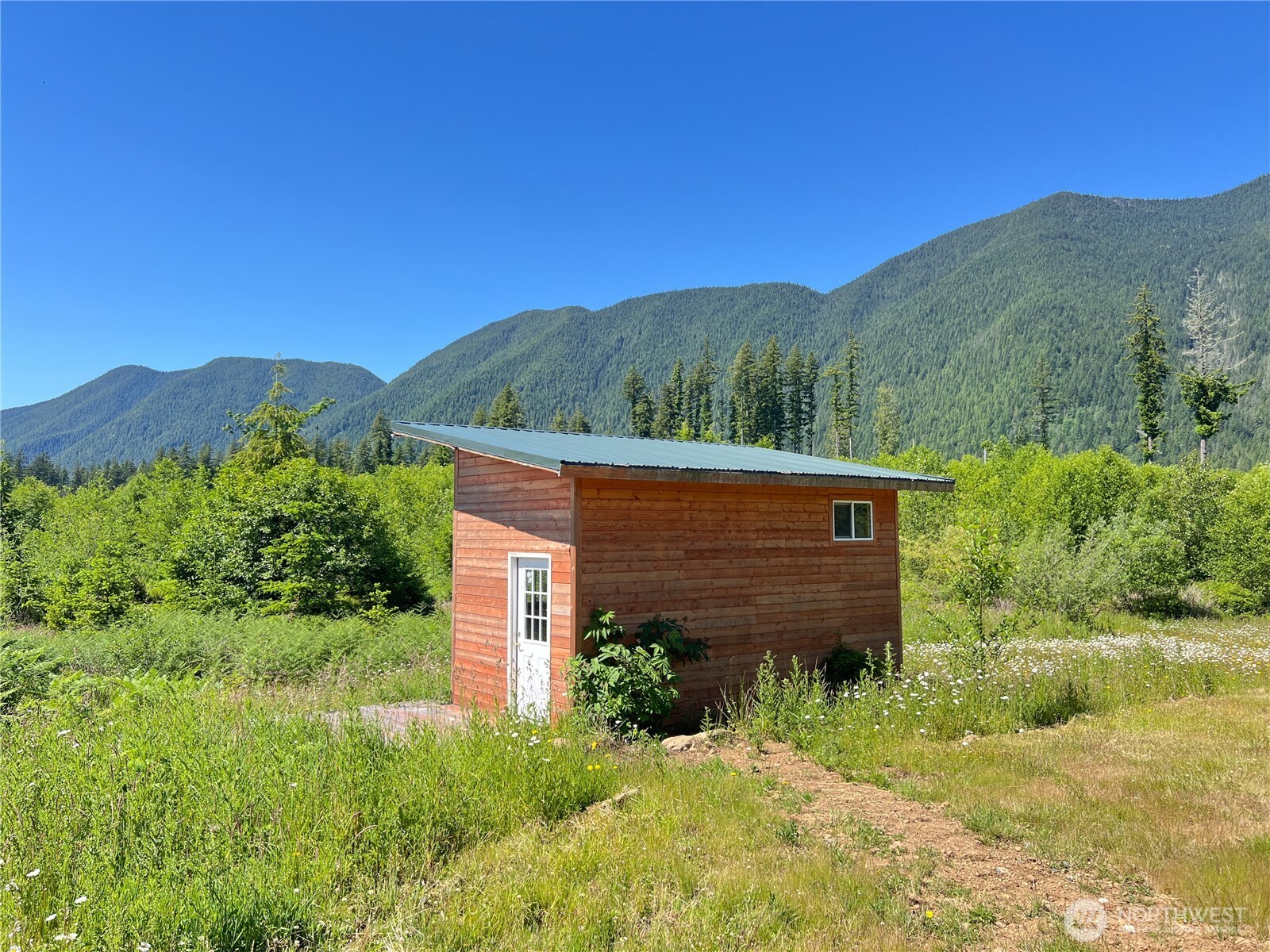 2904 Wildwood Road Quilcene, WA 98376 - Photo 13 of 39 a view of a house with a yard