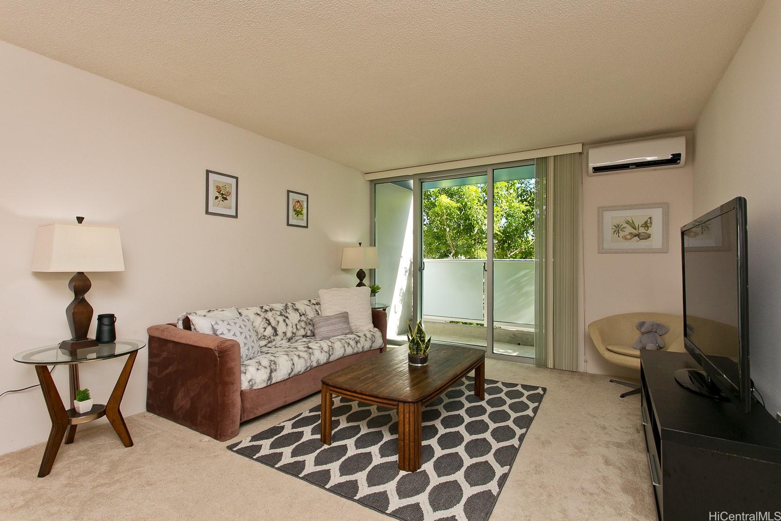 801 South Street, Unit 226 Honolulu, HI 96813 - Photo 1 of 1 a living room with furniture a flat screen tv and a window