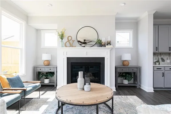 a living room with furniture and a fireplace