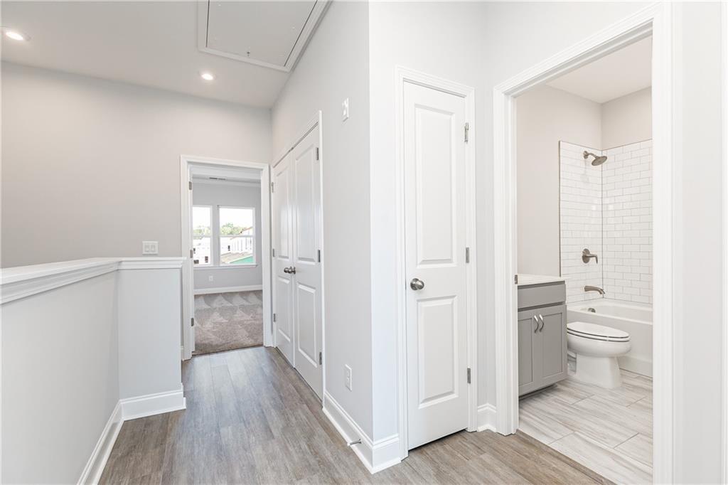 1009 Taylor Court Acworth, GA 30102 - Photo 18 of 30 a bathroom view of a toilet and a hardwood