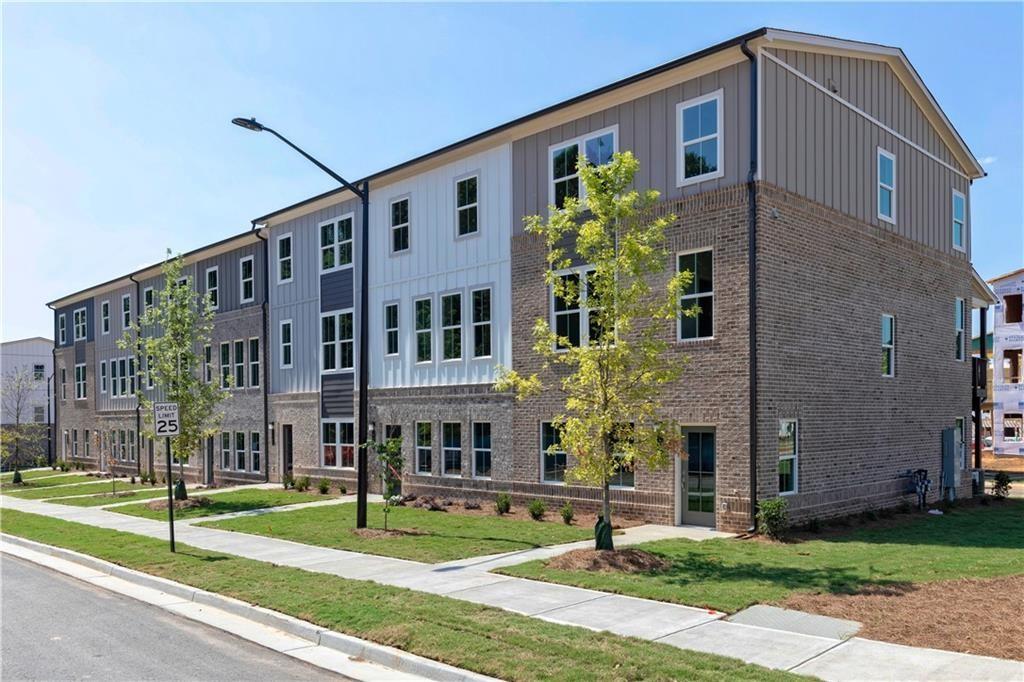 1009 Taylor Court Acworth, GA 30102 - Photo 2 of 30 a front view of a building with garden