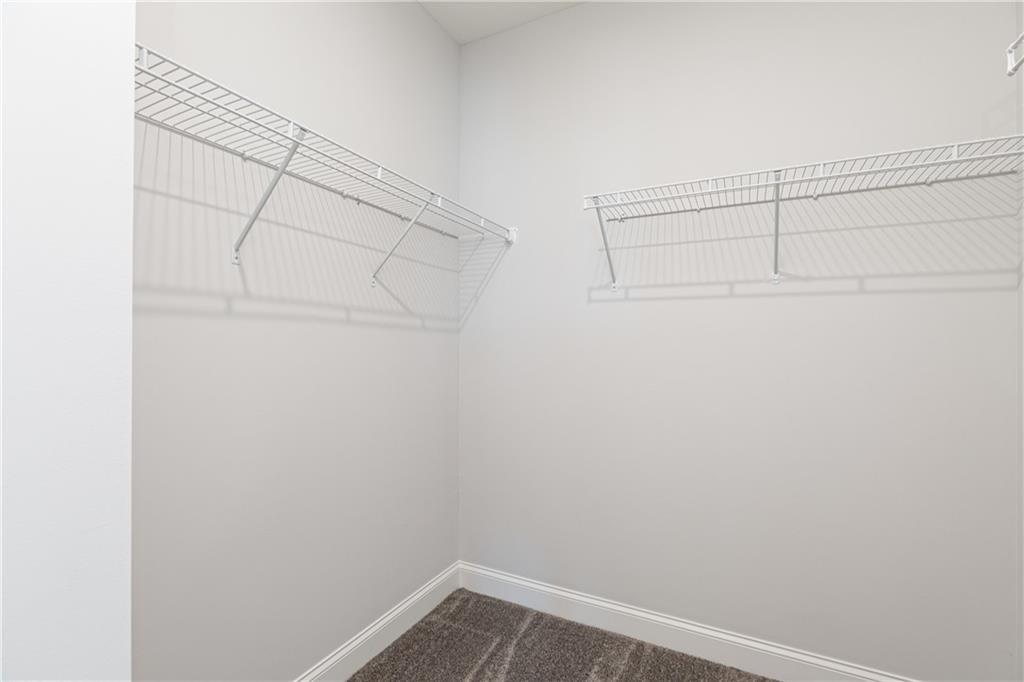 1009 Taylor Court Acworth, GA 30102 - Photo 23 of 30 a view of a room with racks on the wall