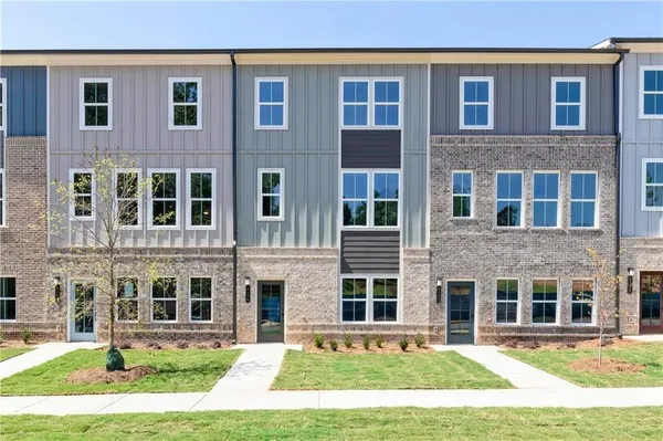 a view of a brick building with many windows