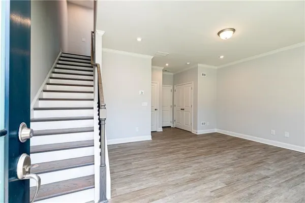 an empty room with wooden floor