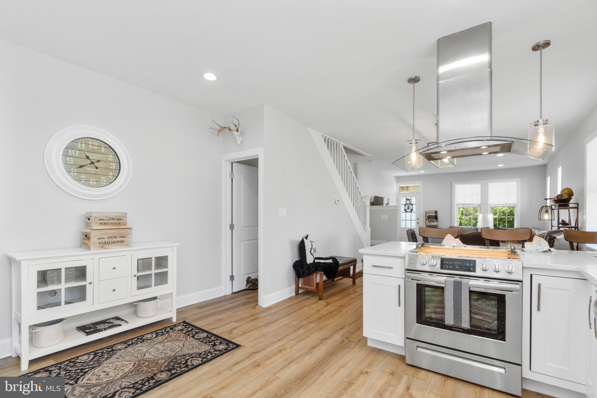 528 Lower E Valley Forge Road King of Prussia, PA 19406 - Photo 15 of 40 a open kitchen with a stove a sink and a refrigerator