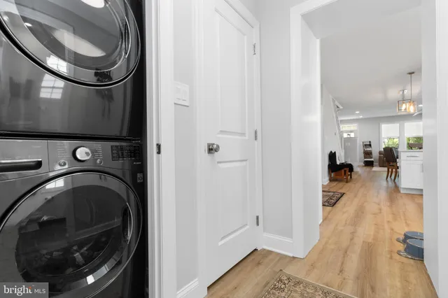 a view of a hallway with washer and dryer
