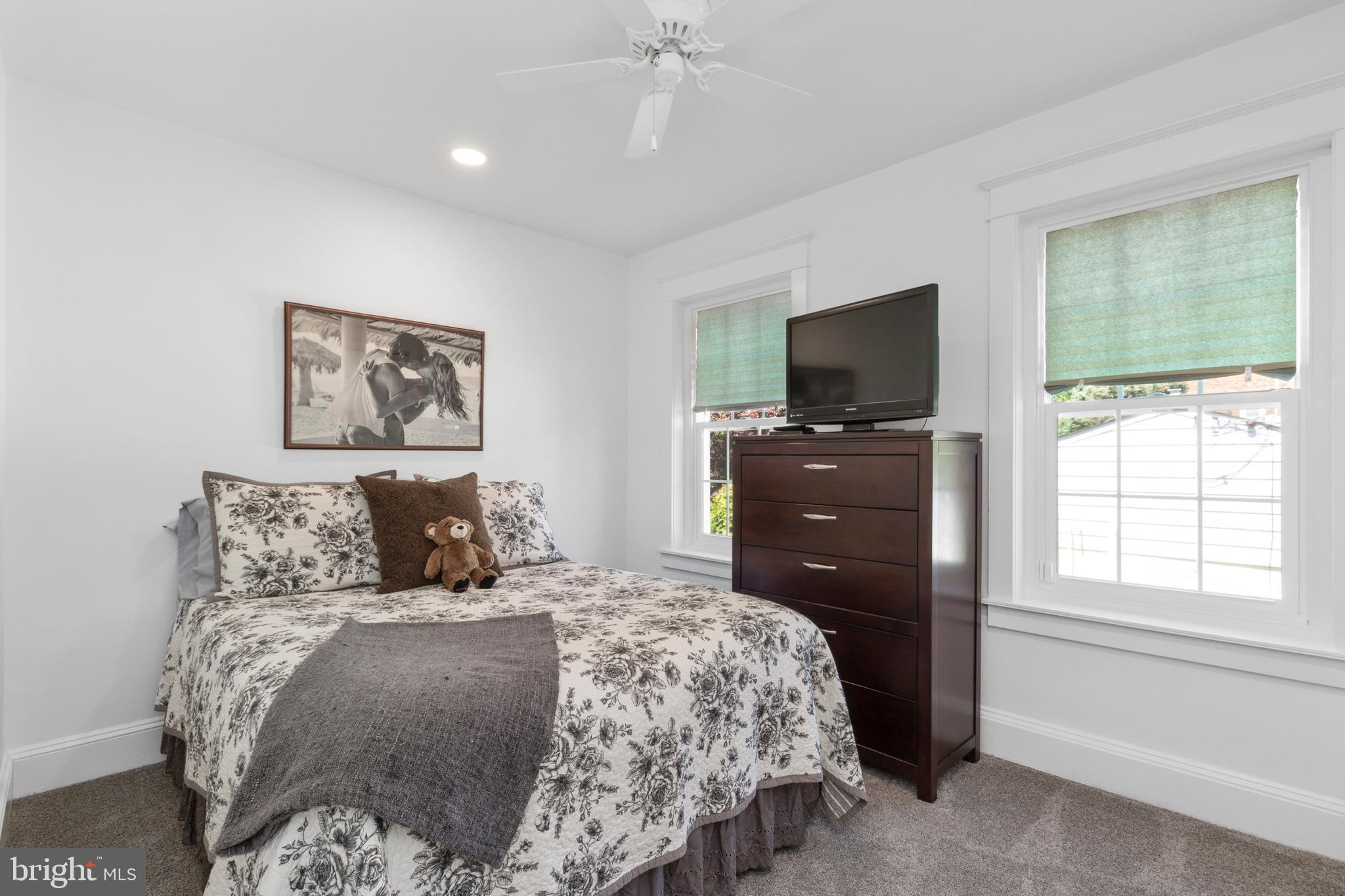 528 Lower E Valley Forge Road King of Prussia, PA 19406 - Photo 23 of 40 a bedroom with a bed and a television