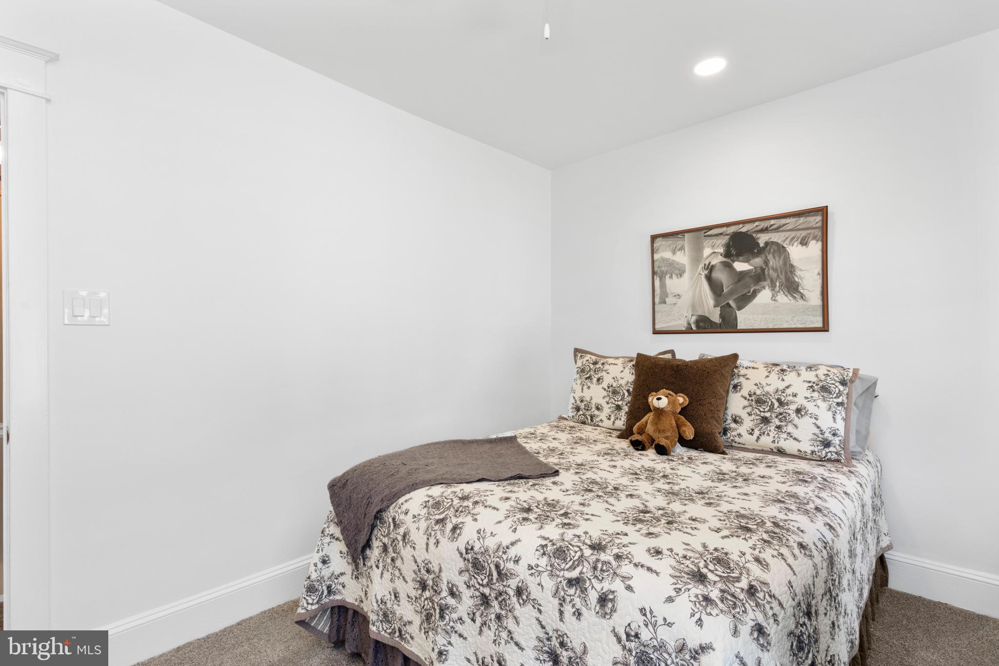 528 Lower E Valley Forge Road King of Prussia, PA 19406 - Photo 24 of 40 a bedroom with a bed and a wall painting