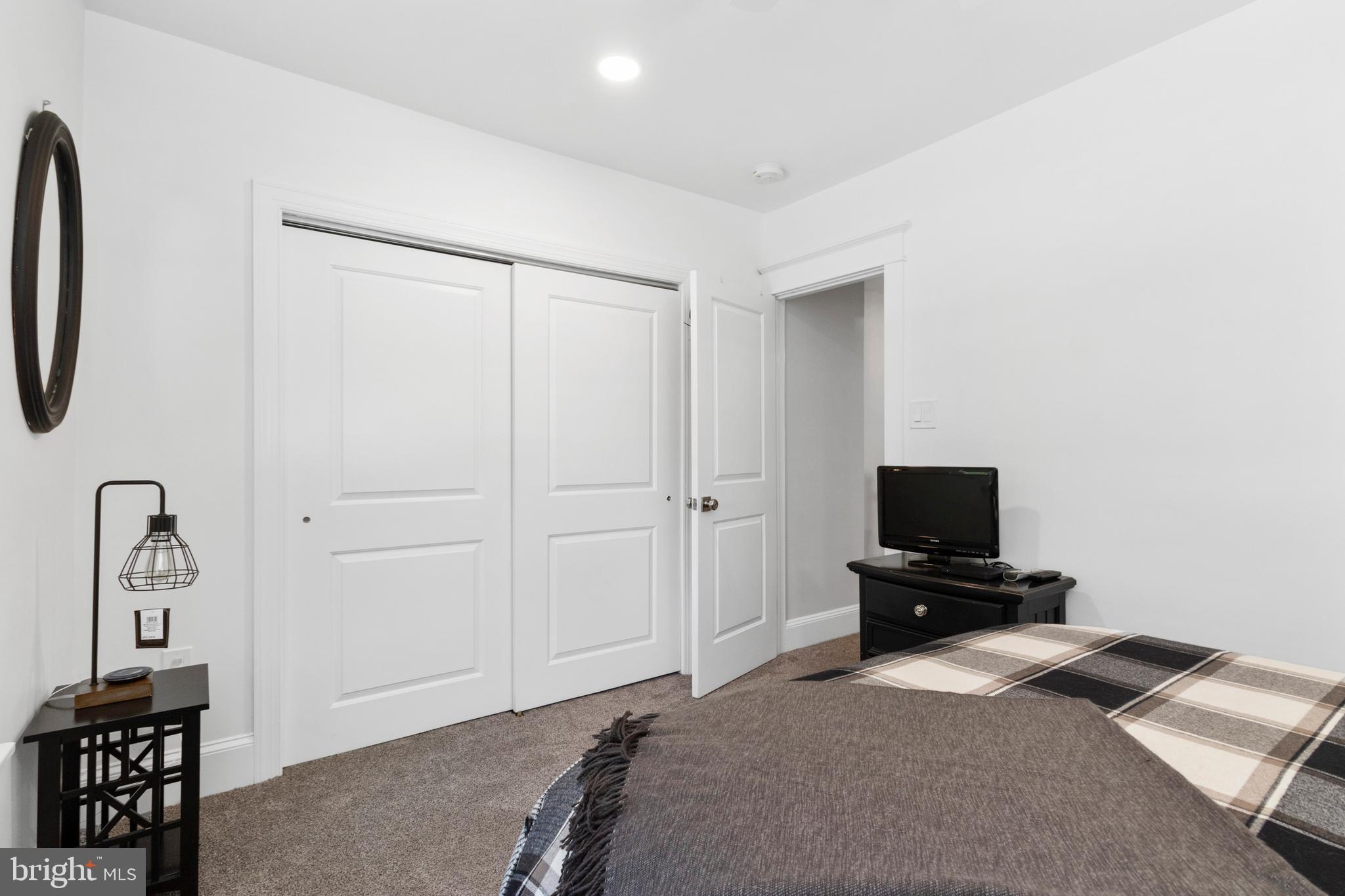528 Lower E Valley Forge Road King of Prussia, PA 19406 - Photo 28 of 40 a bedroom with a bed and a tv on the table