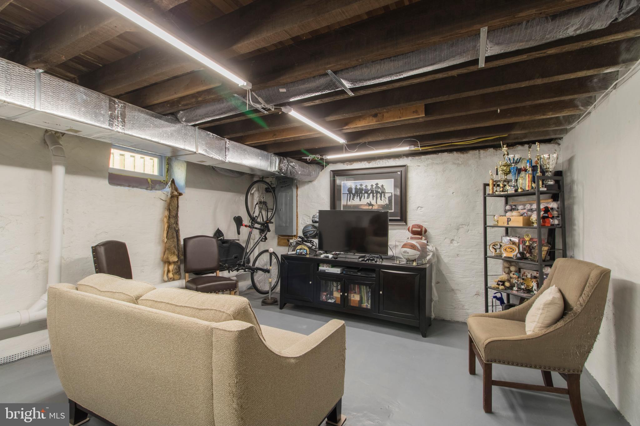 528 Lower E Valley Forge Road King of Prussia, PA 19406 - Photo 31 of 40 a living room with furniture and a flat screen tv