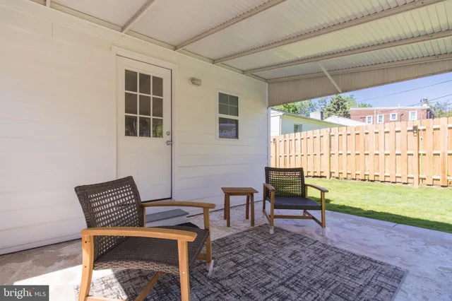 a reading room with furniture and a window