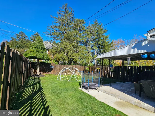 a view of a park with iron fence